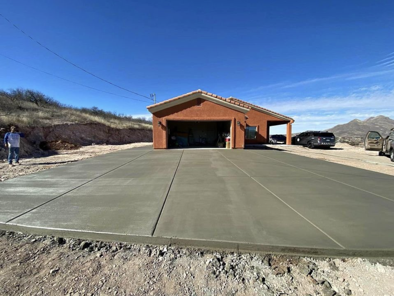Freshly poured wide concrete driveway at a Cornerstone project
